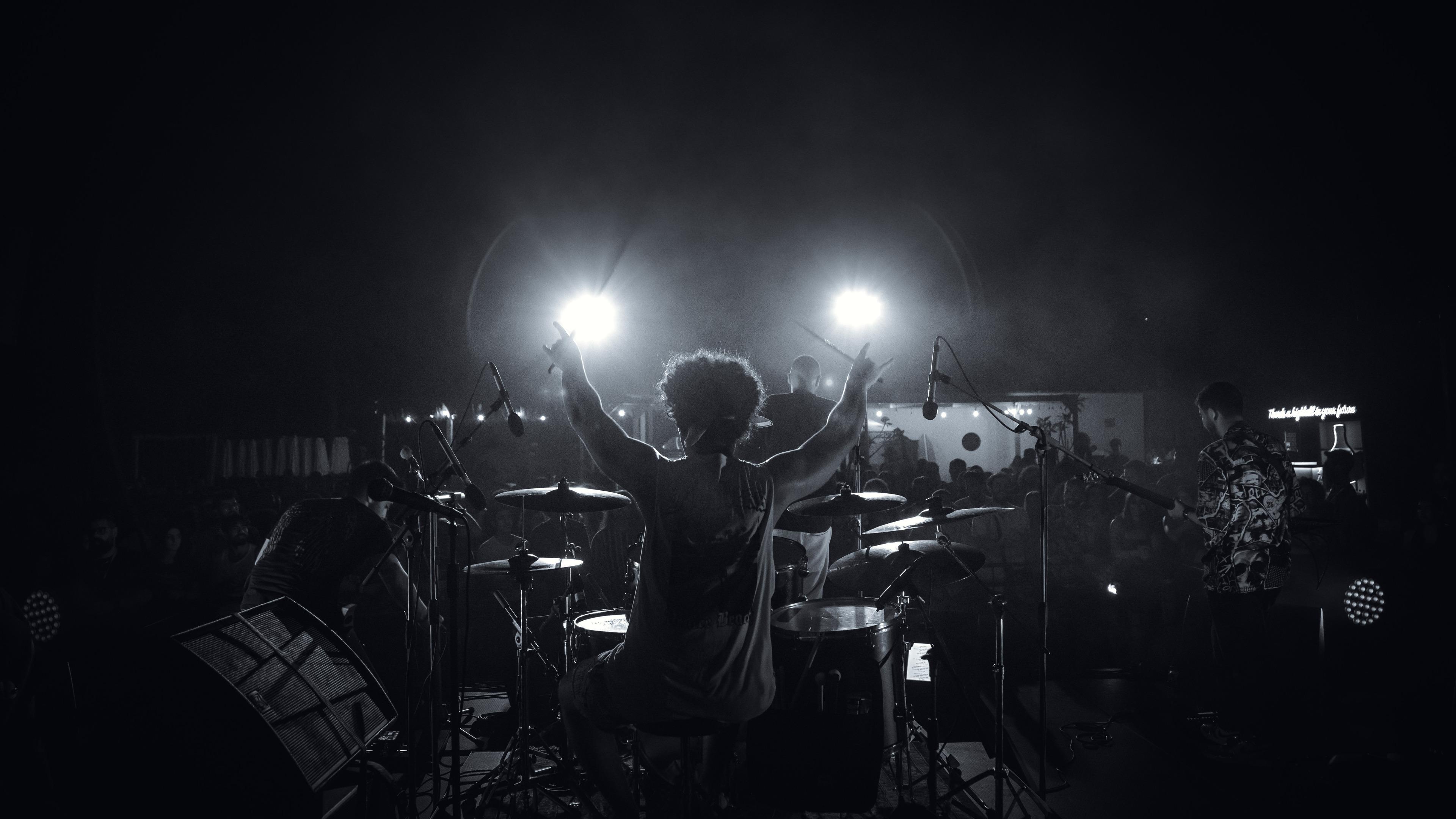 Picture of a band on stage showing a large audience in the background expressing how the MusicLeb news letter will keep them up to date to current musical events.